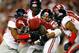 TUSCALOOSA, AL - SEPTEMBER 28: Kenyan Drake #17 of the Alabama Crimson Tide rushes against Derrick Jones #19, Cody Prewitt #25 and Mike Marry #38 of the Mississippi Rebels at Bryant-Denny Stadium on September 28, 2013 in Tuscaloosa, Alabama. (Photo by K