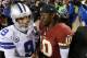 LANDOVER, MD - DECEMBER 30: Quarterbacks Tony Romo #9 of the Dallas Cowboys and Robert Griffin III #10 of the Washington Redskins talk following the Redskins 28-18 win at FedExField on December 30, 2012 in Landover, Maryland. (Photo by Rob Carr/Getty Ima