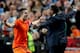 Robin van Persie celebrates breaking Patrick Kluivert's record with the former Dutch international