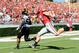 Oct 12, 2013; Athens, GA, USA; Missouri Tigers defensive lineman Michael Sam (52) returns a fumble for a touchdown past Georgia Bulldogs tight end Arthur Lynch (88) during the second quarter at Sanford Stadium. Mandatory Credit: Dale Zanine-USA TODAY Spor