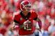 ATHENS, GA - OCTOBER 12: Aaron Murray #11 of the Georgia Bulldogs rolls out against the Missouri Tigers at Sanford Stadium on October 12, 2013 in Athens, Georgia. (Photo by Kevin C. Cox/Getty Images)