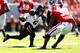 ATHENS, GA - OCTOBER 12: Marcus Murphy #6 of the Missouri Tigers breaks a tackle by Corey Moore #39 of the Georgia Bulldogs on the way to a touchdown at Sanford Stadium on October 12, 2013 in Athens, Georgia. (Photo by Kevin C. Cox/Getty Images)
