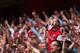 LONDON, ENGLAND - SEPTEMBER 01: Arsenal fans celebrate victory after the Barclays Premier League match between Arsenal and Tottenham Hotspur at Emirates Stadium on September 01, 2013 in London, England. (Photo by Clive Mason/Getty Images)