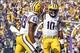 Oct 12, 2013; Baton Rouge, LA, USA; LSU Tigers quarterback Anthony Jennings (10) celebrates after scoring a touchdown against the Florida Gators during the second quarter of a game at Tiger Stadium. Mandatory Credit: Derick E. Hingle-USA TODAY Sports
