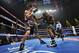 LAS VEGAS, NV - OCTOBER 12: WBO welterweight champion Timothy Bradley Jr. (R) throws a right punch at Juan Manuel Marquez during their bout at the Thomas & Mack Center on October 12, 2013 in Las Vegas, Nevada. (Photo by Jeff Bottari/Getty Images)