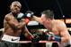 CARSON, CA - MARCH 16: Ruslan Provodnikov, of Russia, (R) lands a punch into the head of WBO welterweight champion Timothy Bradley during the third ninth of the WBO welterweight title boxing match at The Home Depot Center on March 16, 2013 in Carson, Ca