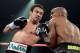 LAS VEGAS, NV - OCTOBER 12: Juan Manuel Marquez (L) lands a left to the head of WBO welterweight champion Timothy Bradley Jr. during their bout at the Thomas & Mack Center on October 12, 2013 in Las Vegas, Nevada. (Photo by Jeff Bottari/Getty Images)