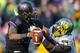 SEATTLE, WA - OCTOBER 12: Quarterback Keith Price #17 of the Washington Huskies is tackled by DeForest Buckner #44 of the Oregon Ducks on October 12, 2013 at Husky Stadium in Seattle, Washington. The Ducks defeated the Huskies 45-24. (Photo by Otto Greu