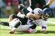 Oct 12, 2013; Madison, WI, USA; Northwestern Wildcats quarterback Trevor Siemian (13) is sacked by Wisconsin Badgers linebacker Vince Biegel (47) during the second quarter at Camp Randall Stadium. Mandatory Credit: Jeff Hanisch-USA TODAY Sports
