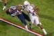 OXFORD, MS - OCTOBER 12: Wide receiver Malcome Kennedy #84 of the Texas A&M Aggies stiff arms defensive back Trae Elston #7 of the Ole Miss Rebels during the second half of play on October 12, 2013 at Vaught-Hemingway Stadium in Oxford, Mississippi. Texas