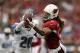 GLENDALE, AZ - SEPTEMBER 15: Wide receiver Larry Fitzgerald #11 of the Arizona Cardinals isn't able to hold on to the ball while being pursued by cornerback Bill Bentley #28 of the Detroit Lions in the third quarter at University of Phoenix Stadium on Se