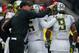 SEATTLE, WA - OCTOBER 12: Head coach Mark Helfrich of the Oregon Ducks pats running back Byron Marshall #9 on the head after he scored a touchdown in the second quarter against the Washington Huskies on October 12, 2013 at Husky Stadium in Seattle, Washi