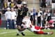 WEST LAFAYETTE, IN - OCTOBER 12: Randy Gregory #44 of the Nebraska Cornhuskers sacks Danny Etling #5 of the Purdue Boilermakers in the end zone for a safety during the game at Ross-Ade Stadium on October 12, 2013 in West Lafayette, Indiana. Nebraska won 4