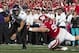 Oct 12, 2013; Madison, WI, USA; Northwestern Wildcats quarterback Kain Colter (2) avoids Wisconsin Badgers nose tackle Beau Allen (96) during the first quarter at Camp Randall Stadium. Mandatory Credit: Jeff Hanisch-USA TODAY Sports