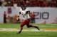 MIAMI GARDENS, FL - JANUARY 01: Jordan Lynch #6 of the Northern Illinois Huskies points as he looks to pass against the Florida State Seminoles during the Discover Orange Bowl at Sun Life Stadium on January 1, 2013 in Miami Gardens, Florida. (Photo by S