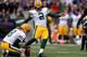 BALTIMORE, MD - OCTOBER 13: Place kicker Mason Crosby #2 of the Green Bay Packers kicks a field goal against the Baltimore Ravens in the first quarter at M&T Bank Stadium on October 13, 2013 in Baltimore, Maryland. (Photo by Patrick Smith/Getty Images)