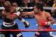 LAS VEGAS, NV - JUNE 09: (R-L) Manny Pacquiao lands a right to the head of Timothy Bradley during their WBO welterweight title fight at MGM Grand Garden Arena on June 9, 2012 in Las Vegas, Nevada. (Photo by Jeff Bottari/Getty Images)