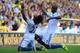 NORWICH, ENGLAND - OCTOBER 06: Willian of Chelsea celebrates scoring their third goal with Ramires of Chelsea during the Barclays Premier League match between Norwich City and Chelsea at Carrow Road on October 6, 2013 in Norwich, England. (Photo by Jami