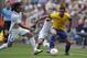 NEWCASTLE, UNITED KINGDOM - AUGUST 4: Roger Espinoza of Honduras and Sandro of Brazil battle for the ball during the Men's Football Quarter Final match between Brazil and Honduras, on Day 8 of the London 2012 Olympic Games at St James' Park on August 4