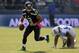 SEATTLE, WA. - OCTOBER 13: Quarterback Russell Wilson #3 of the Seattle Seahawks runs out of the pocket away from defensive end Ropati Pitoitua #92 of the Tennessee Titans during the second quarter of the game at CenturyLink Field on October 13, 2013 in S