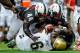 LINCOLN, NE - SEPTEMBER 14: Defensive end Randy Gregory #44 of the Nebraska Cornhuskers and linebacker Zaire Anderson #13 of the Nebraska Cornhuskers scramble for a loose ball knocked away from running back Jordon James #6 of the UCLA Bruins during their