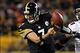 Sep 22, 2013; Pittsburgh, PA, USA; Pittsburgh Steelers quarterback Ben Roethlisberger (7) fumbles the ball as he runs from Chicago Bears defensive end Corey Wootton (98) during the second half at Heinz Field. The Bears won the game, 40-23. Mandatory Credi