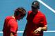 MELBOURNE, AUSTRALIA - JANUARY 15: Roger Federer of Switzerland and his coach Paul Annacone chat during a practice session ahead of the 2012 Australian Open at Melboure Park on January 15, 2012 in Melbourne, Australia. (Photo by Mark Dadswell/Getty Imag