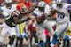 CLEVELAND, OH - OCTOBER 13: Running back Reggie Bush #21 of the Detroit Lions scores a touchdown as his is hit by defensive back Tashaun Gipson #39 of the Cleveland Browns at FirstEnergy Stadium on October 13, 2013 in Cleveland, Ohio. (Photo by Matt Sul