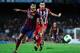 BARCELONA, SPAIN - AUGUST 28: Cesc Fabregas (L) of FC Barcelona is challenged by Mario Suarez of Atletico de Madrid during the Spanish Super Cup second leg match between FC Barcelona and Atletico de Madrid at Nou Camp on August 28, 2013 in Barcelona, Spa