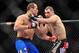 Dec 29, 2012; Las Vegas, NV, USA; Junior Dos Santos (left) and Cain Velasquez (right) exchange strikes during UFC 155 at the MGM Grand Garden Arena. Mandatory Credit: Gary A. Vasquez-USA TODAY Sports