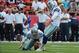 Sep 15, 2013; Kansas City, MO, USA; Dallas Cowboys kicker Dan Bailey (5) kicks a field goal with the help of holder Chris Jones (6) against the Kansas City Chiefs in the first half at Arrowhead Stadium. Mandatory Credit: John Rieger-USA TODAY Sports
