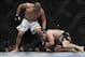 May 25, 2013; Las Vegas, NV, USA; Cain Velasquez grabs the ankle of Antonio Silva during UFC 160 at the MGM Grand Garden Arena. Mandatory Credit: Gary A. Vasquez-USA TODAY Sports