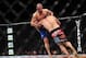 Dec 29, 2012; Las Vegas, NV, USA; Cain Velasquez (right) takes down Junior Dos Santos (left) during UFC 155 at the MGM Grand Garden Arena. Mandatory Credit: Gary A. Vasquez-USA TODAY Sports