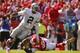 KANSAS CITY, MO - OCTOBER 13: Terrelle Pryor #2 of the Oakland Raiders avoids the tackle attempt by Justin Houston #50 of the Kansas City Chiefs in the second quarter October 13, 2013 at Arrowhead Stadium in Kansas City, Missouri. (Photo by Kyle Rivas/Get