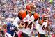 Oct 13, 2013; Orchard Park, NY, USA; Cincinnati Bengals quarterback Andy Dalton (14) runs the ball against Buffalo Bills defensive end Alan Branch (90) during the second half at Ralph Wilson Stadium. Bengals beat the Bills 27-24 in overtime. Mandatory Cre