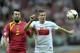 WARSAW, POLAND - SEPTEMBER 06: Marko Basa of Montenegro competes for the ball with Robert Lewandowski (R) during the FIFA 2014 World Cup Qualifier between Poland and Montenegro at the National Stadium on September 06, 2013 in Warsaw, Poland. (Photo by A