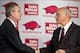 April 24, 2012; Fayetteville, AR, USA; Arkansas Razorbacks athletic director Jeff Long shakes hands with newly announced head coach John L. Smith following a press conference at the Broyles Athletic Center. Mandatory Credit: Beth Hall-USA TODAY Sports