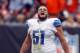 CLEVELAND, OH - OCTOBER 13: Center Dominic Raiola #51 of the Detroit Lions celebrates a touchdown as he walks off the field against the Cleveland Browns at FirstEnergy Stadium on October 13, 2013 in Cleveland, Ohio. (Photo by Matt Sullivan/Getty Images)