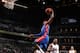 NEW YORK, NY - OCTOBER 12: Josh Smith #6 of the Detroit Pistons rises for a dunk in a preseason game against the Brooklyn Nets at the Barclays Center on October 12, 2013 in the Brooklyn borough of New York City. NOTE TO USER: User expressly acknowledges