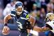 Sep 22, 2013; Seattle, WA, USA; Seattle Seahawks quarterback Russell Wilson (3) scrambles out of the pocket against the Jacksonville Jaguars during the third quarter at CenturyLink Field. Mandatory Credit: Joe Nicholson-USA TODAY Sports