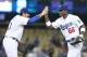 LOS ANGELES, CA - JUNE 04: Right fielder Yasiel Puig #66 of the Los Angeles Dodgers celebrates with first baseman Adrian Gonzalez #23 after the game with the San Diego Padres at Dodger Stadium on June 4, 2013 in Los Angeles, California. (Photo by Stephe
