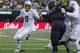 A rowdy crowd and a much-improved Washington defense had little effect on Marcus Mariota's performance.