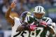 EAST RUTHERFORD, NJ - OCTOBER 13: Tight end Jeff Cumberland #87 of the New York Jets attempts to outrun safety Ryan Clark #25 of the Pittsburgh Steelers after making a first down catch in the third quarter during a game at MetLife Stadium on October 13, 2