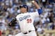 October 14, 2013; Los Angeles, CA, USA; Los Angeles Dodgers starting pitcher Hyun-Jin Ryu (99) pitches the first inning against the St. Louis Cardinals in game three of the National League Championship Series baseball game at Dodger Stadium. Mandatory Cr