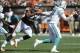 Sep 8, 2013; Cleveland, OH, USA; Cleveland Browns linebacker Jabaal Sheard (97) chases Miami Dolphins quarterback Ryan Tannehill (17) during the third quarter at FirstEnergy Stadium. Mandatory Credit: Ken Blaze-USA TODAY Sports