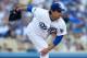 LOS ANGELES, CA - OCTOBER 06: Pitcher Hyun-Jin Ryu #99 of the Los Angeles Dodgers pitches in the first inning against the Atlanta Braves during Game Three of the National League Division Series at Dodger Stadium on October 6, 2013 in Los Angeles, Califor