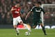 MANCHESTER, ENGLAND - MARCH 05: Robin van Persie of Manchester United competes with Sami Khedira of Real Madrid during the UEFA Champions League Round of 16 Second leg match between Manchester United and Real Madrid at Old Trafford on March 5, 2013 in Ma