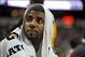 Jul 25, 2013; Las Vegas, NV, USA; USA White Team forward Kyrie Irving looks into the crowd from the bench during the 2013 USA Basketball Showcase at the Thomas and Mack Center. Mandatory Credit: Stephen R. Sylvanie-USA TODAY Sports