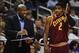Oct 11, 2013; Orlando, FL, USA; Cleveland Cavaliers head coach Mike Brown talks with point guard Kyrie Irving (2) during the first quarter during game against the Orlando Magic at Amway Center. Mandatory Credit: David Manning-USA TODAY Sports