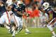 AUBURN, AL - NOVEMBER 10: Quarterback Jonathan Wallace #12 of the Auburn Tigers prepares to hand the ball off to running back Tre Mason #21 of the Auburn Tigers during their game against the Georgia Bulldogs on November 10, 2012 at Jordan-Hare Stadium in